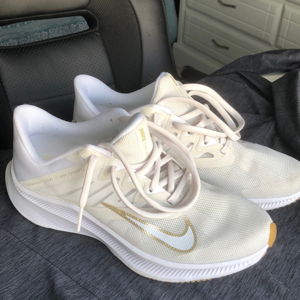 White and Gold Nike Quest Running Shoes